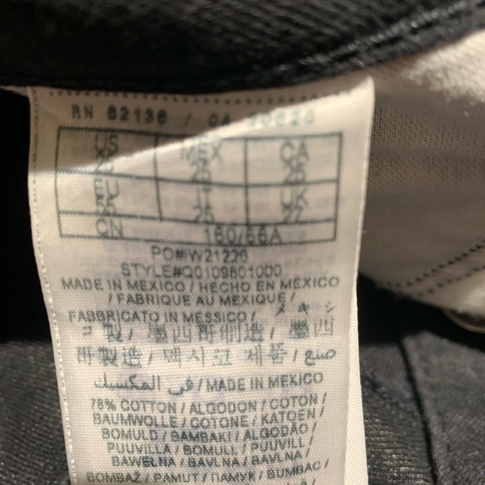 Guess medium rise, tapered leg black Jeans.
